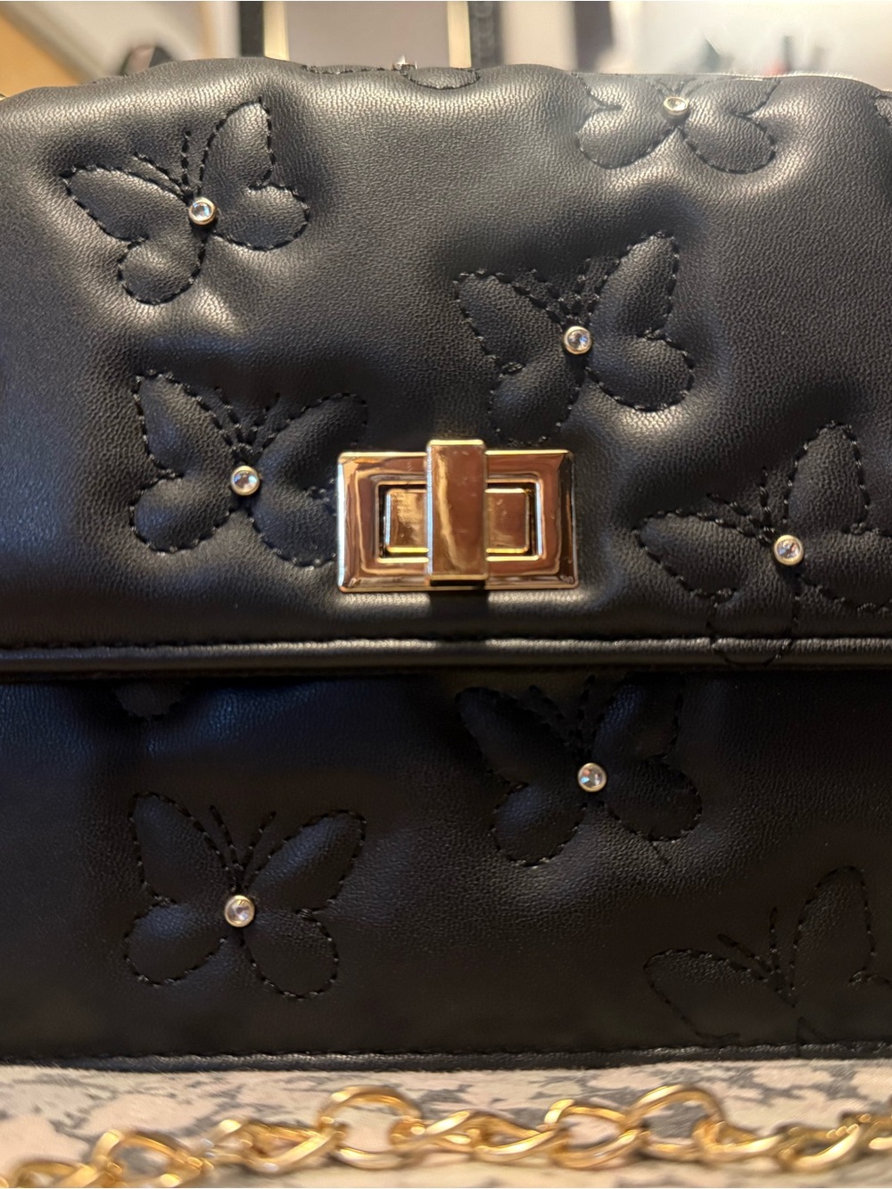 Black Quilted Butterfly Crossbody Bag with Gold Hardware